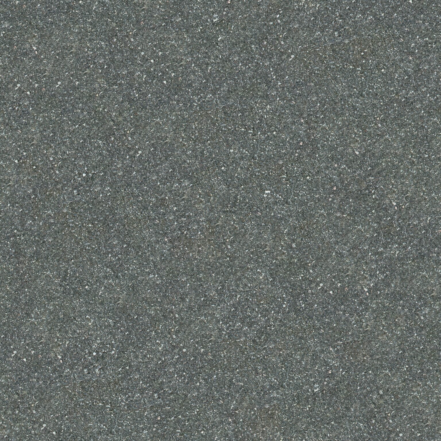 Sand & Aggregate Supply Detailed close-up of rough gray asphalt showcasing its texture and rugged surface.